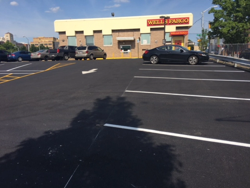 Completed asphalt paving and line striping at a Wells Fargo parking lot in Baltimore, Maryland