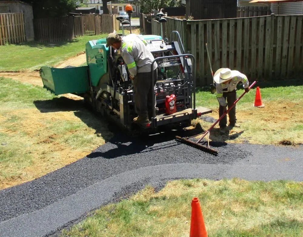 Professional paving services crew installing asphalt