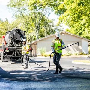 Sealcoating services being performed in Tanglewood by Chamberlain Contractors