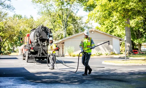 Sealcoating services being performed by Chamberlain Contractors