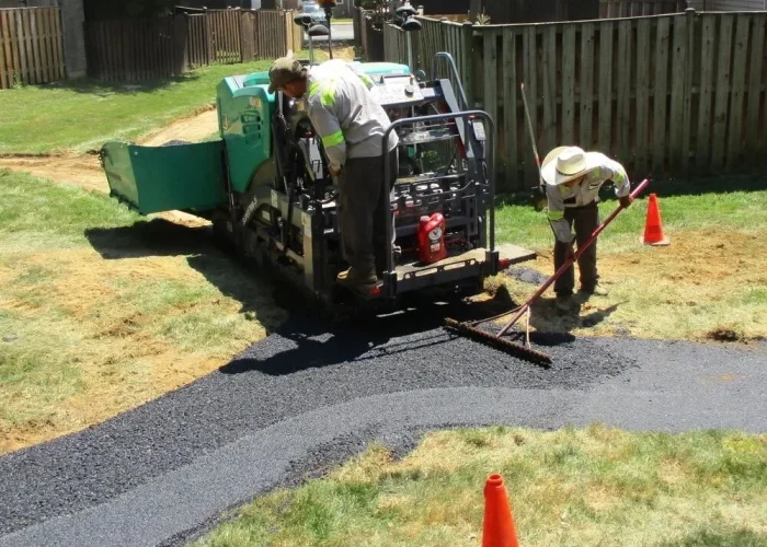 Professional paving services crew installing asphalt