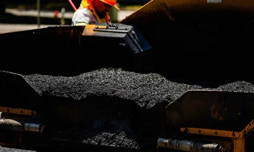 Bed of work truck loaded with fresh asphalt