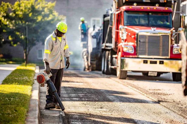 Contractor using a leaf blower